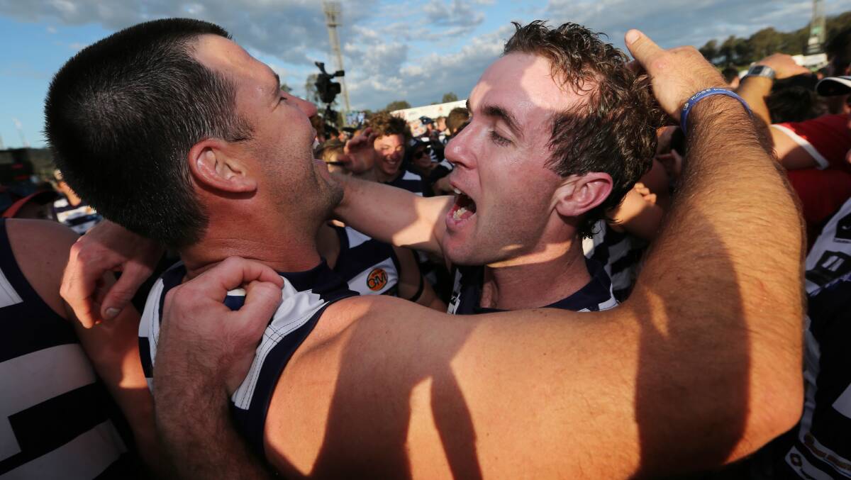 Brad O'Connor and Leslie celebrate the 2013 grand final win over Albury at Lavington. Leslie won the Morris Medal in 2013, came runner-up in 2012 and third in 2008.