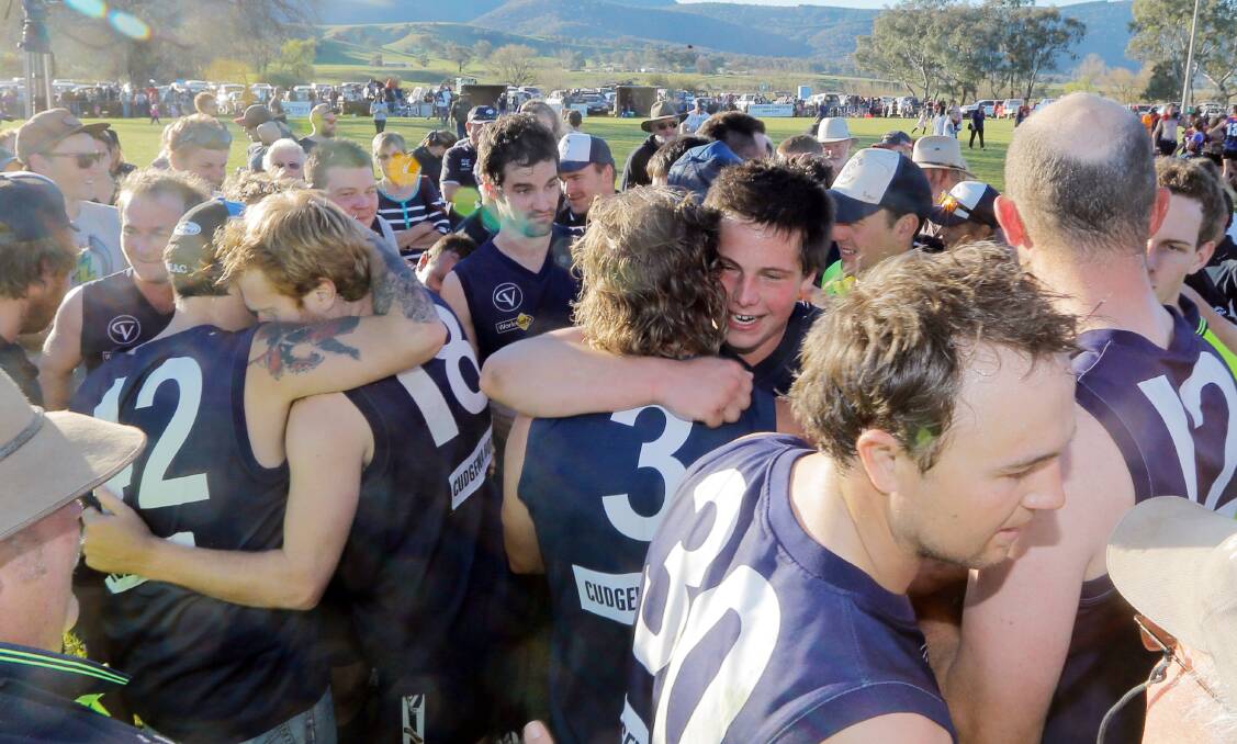 Cudgewa players and supporters celebrate its last premiership success in 2014. The Blues want the Upper Murray league to continue.