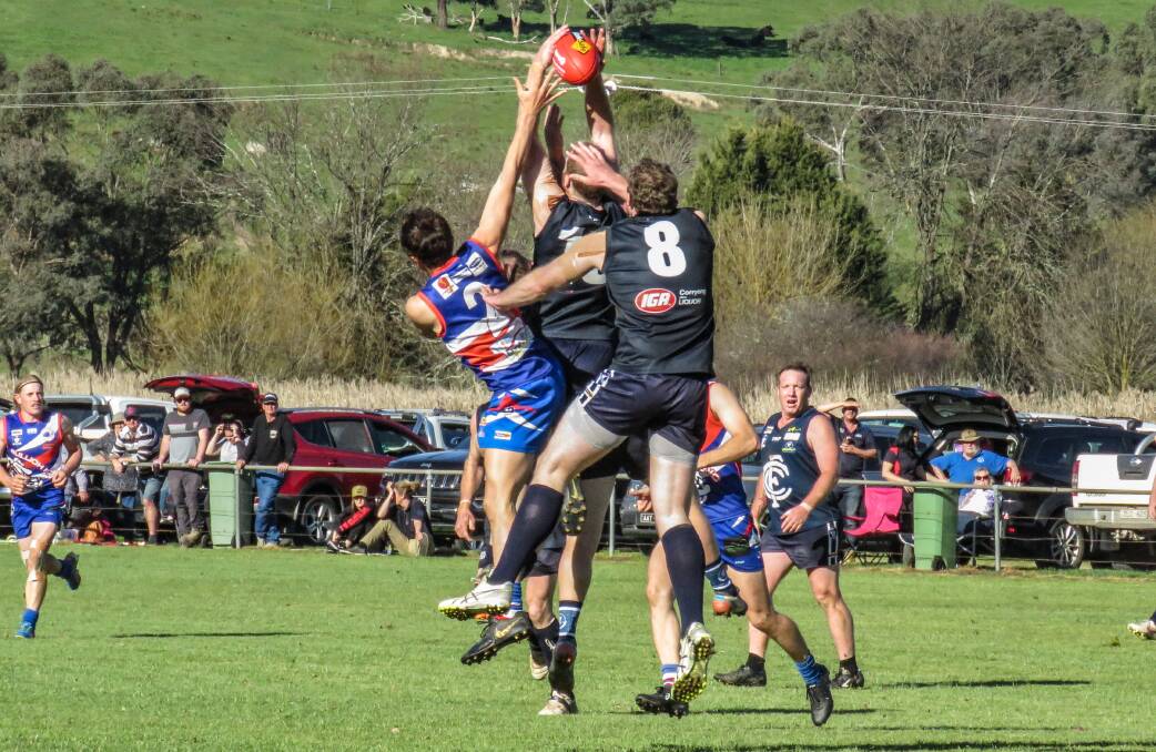 STRONG HANDS: Cudgewa's Kade Small has front position in a marking contest against Bullioh at Cudgewa on Saturday. Picture: WENDY LAVIS