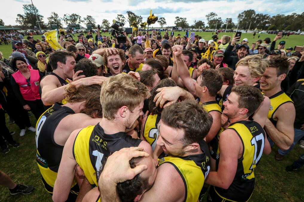 39-year-old Hayden Gleeson celebrates his 10th flag with Tiger teammates. Picture: JAMES WILTSHIRE