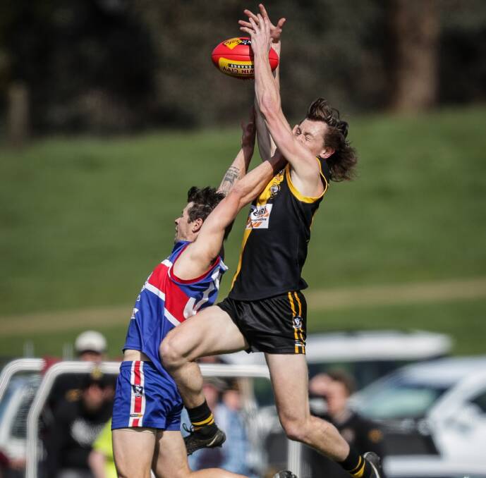 Barnawartha's Josh Star soars over a Thurgoona opponent in the Tallangatta and District league last season. He and Geelong Amateur's Kurt Jenson have signed with Rand-Walbundrie-Walla.