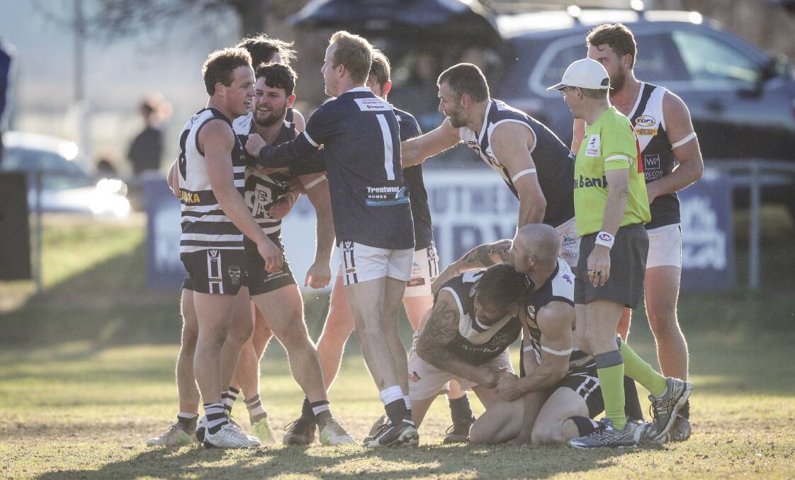 SPOT FIRES: Tempers erupted during Rutherglen's clash with Mitta United on Saturday. The Blues won by a point. Pictures: JAMES WILTSHIRE