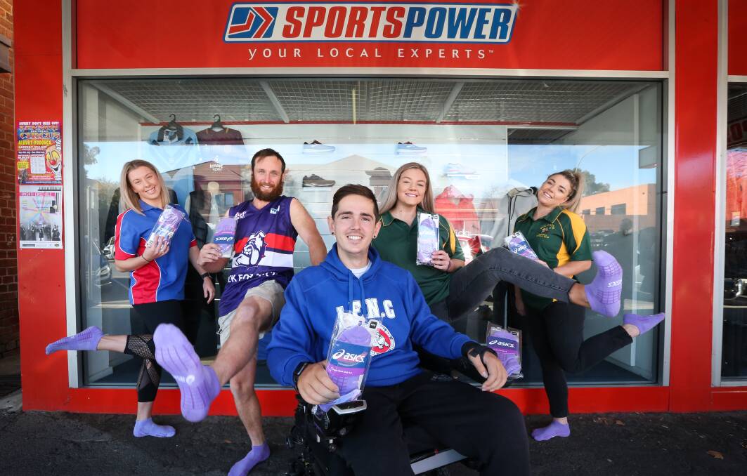 Jindera's Jess Guy and Matt Osborne and Holbrook's Lucy and Meg McInnes with former Bulldog player Nick Dempsey. Picture: KYLIE ESLER