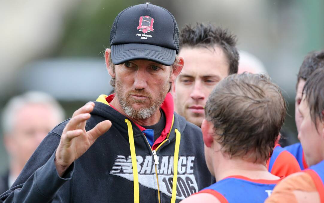 Beechworth coach Shaun Pritchard calls for a big effort from his players at three quarter-time at Thurgoona on Saturday.