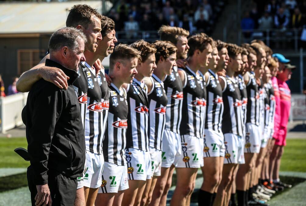 Wangaratta's Dean Stone and his players line-up before last season's grand final at Norm Minns Oval.