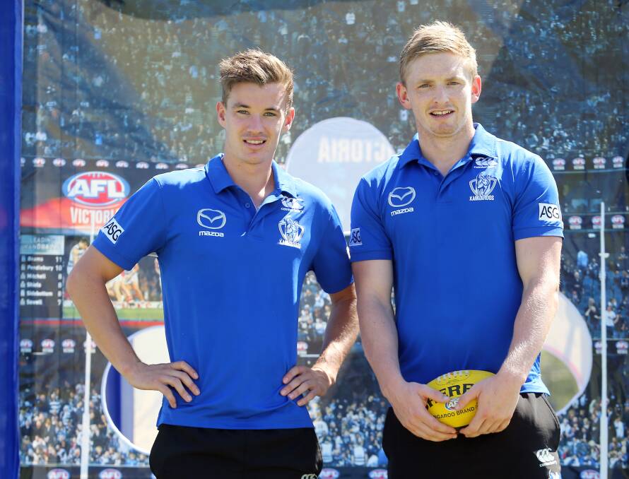 Kayne Turner with Roo captain Jack Ziebell in Wodonga earlier this year. Turner has signed on for two more seasons.