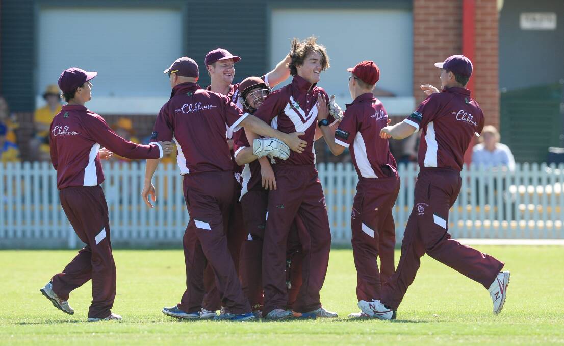Wodonga youngster Charlie Jackson celebrates a wicket with teammates against New City on Saturday.