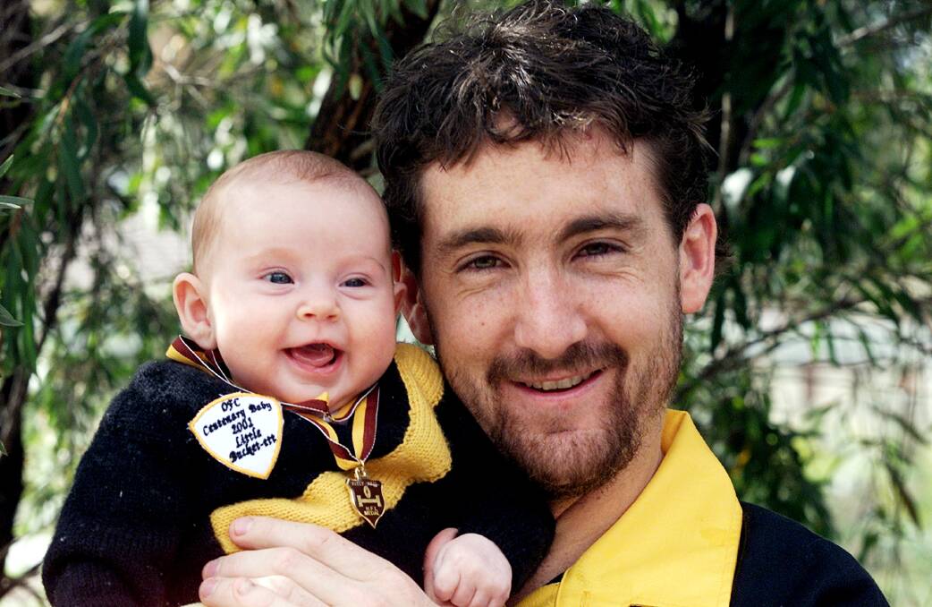 Clarke with his daughter Holly in 2001.