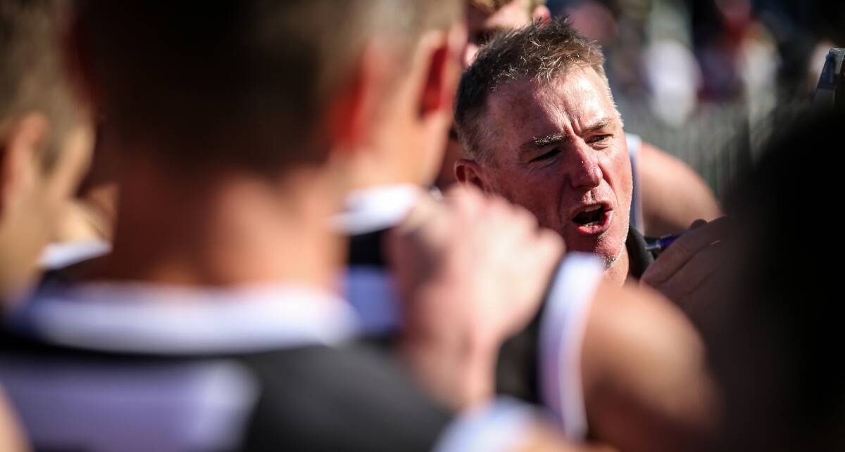 Dean Stone addresses his players during Sunday's
grand final. Picture: JAMES WILTSHIRE