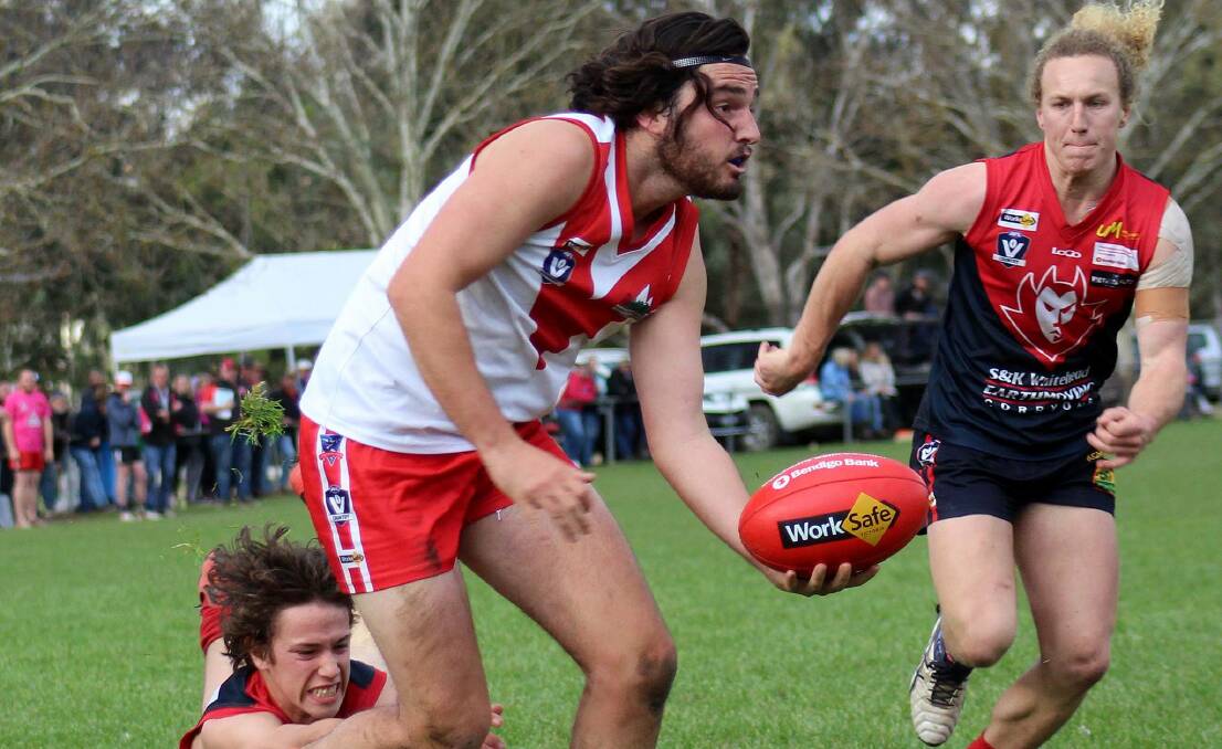 Federal's Tom McKimmie has the jump on Corryong's Tom Shanks and Matt Damm during Saturday's preliminary final. Picture: DEB HARRAP