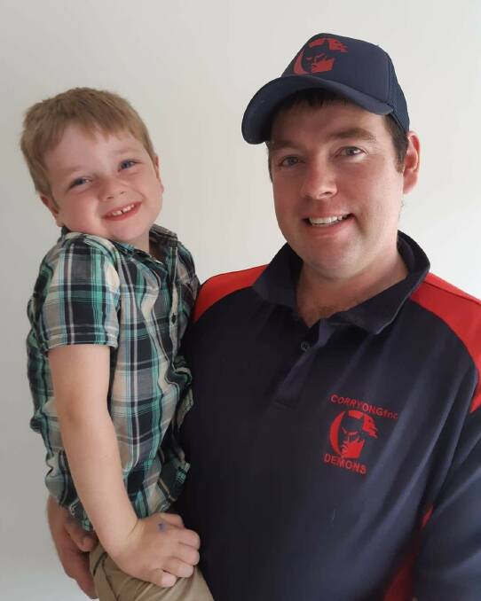 Corryong president Owen Johnstone and his son, Kayde, 4, who started playing Auskick at the weekend. The Demons desperately need reserve grade players to field a side.