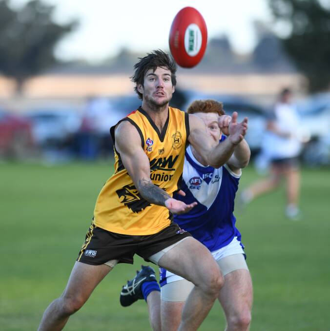 Lively Hume forward Tyson Neander marks in front of Farrer defender Shane Bourchier at Osborne on Saturday. Picture: DAILY ADVERTISER