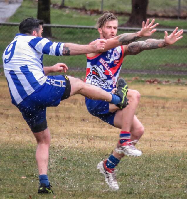 Tumbarumba's Jake Webster gets a kick away at Tumbarumba on Saturday. The Roos went down to Bullioh by 135 points. Picture: WENDY LAVIS