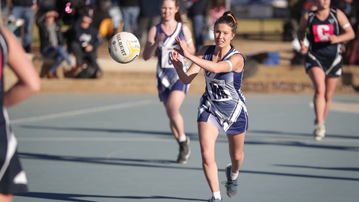Mitta United's Olivia Miller drives the Blues into attack in their Tallangatta and District netball clash at Rutherglen on Saturday.