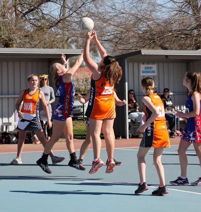 Jindera and Rand-Walbundrie-Walla netballers in action last season. League officials have called off all football and netball.
