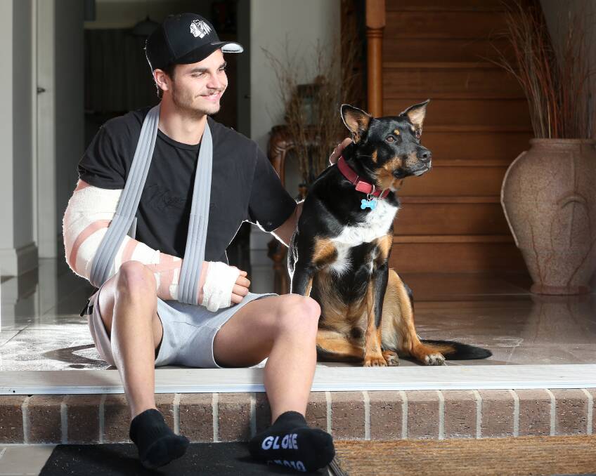 Injured Wodonga Raider
Matt Neagle with his dog Bax.
Picture: KYLIE ESLER