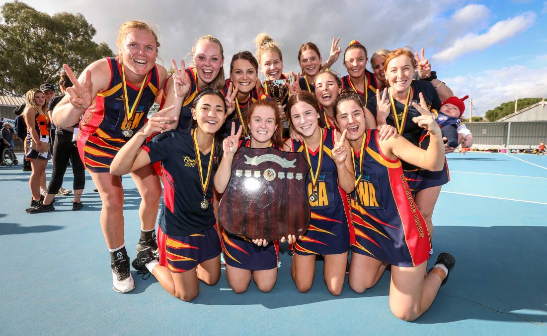 CHAMPIONS. The Billabong Crows celebrate back-to-back A grade flags on Saturday. The Crows also saluted in B grade.