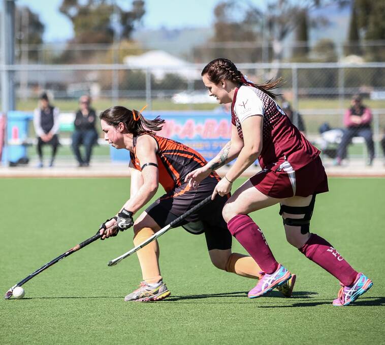 Falcons' Jess Madden and Kyrie Hardwick do battle in the grand final.