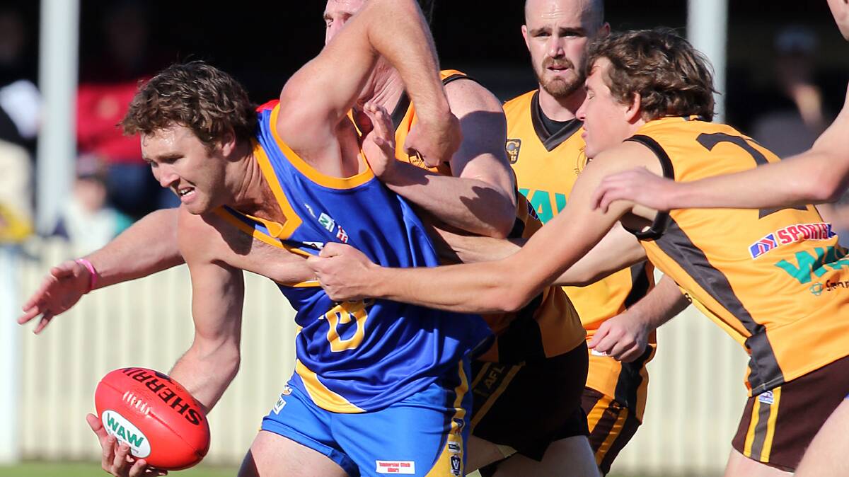 TDFL midfielder Craig Lieschke and Hume's Heath Ohlin do battle at Albury Sportsground in 2013. The leagues will clash at Sandy Creek in May.