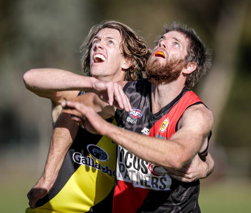 TWO OF THE BEST: Azzi medallists Jamie Parr and Peter Hancock do battle at Howlong on Saturday. Pictures: MARK JESSER
