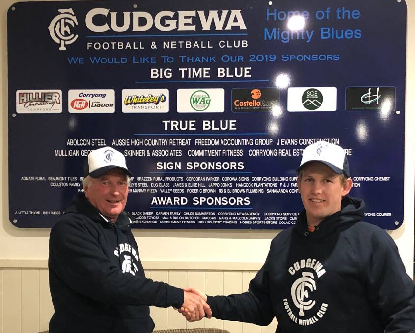 Cudgewa president Greg Hillier congratulates Blues coach Brayden Carey on signing on for another term. The club is well placed for a tilt at this year's premiership.