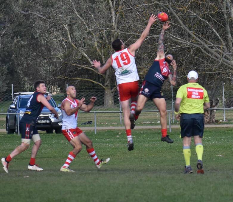 Old rivals Federal and Corryong lock horns in 2019. The Swans will decide their future at next month's annual general meeting. Picture: DEB HARRAP