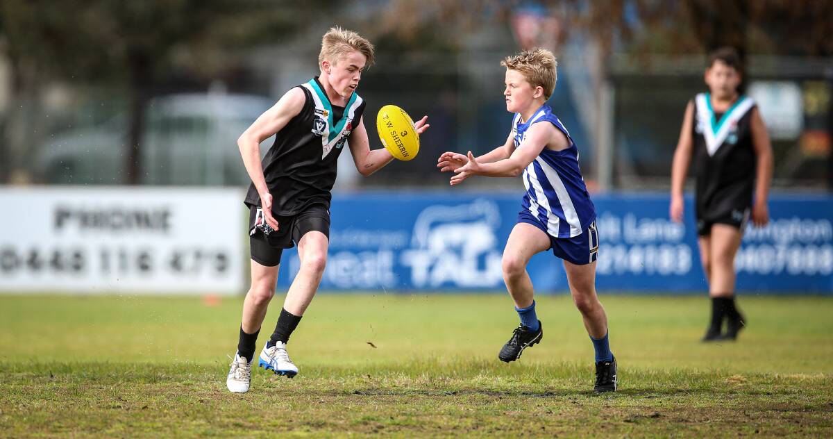Lavington youngster Mitch Adams wins possession under pressure from Corowa-Rutherglen at Urana Road Oval on Saturday. Picture: JAMES WILTSHIRE
