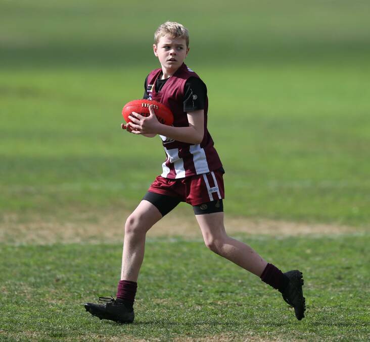 Mason Harris in action for Wodonga's under-12s. The young Bulldogs went down to Corowa-Rutherglen at Birallee Park.