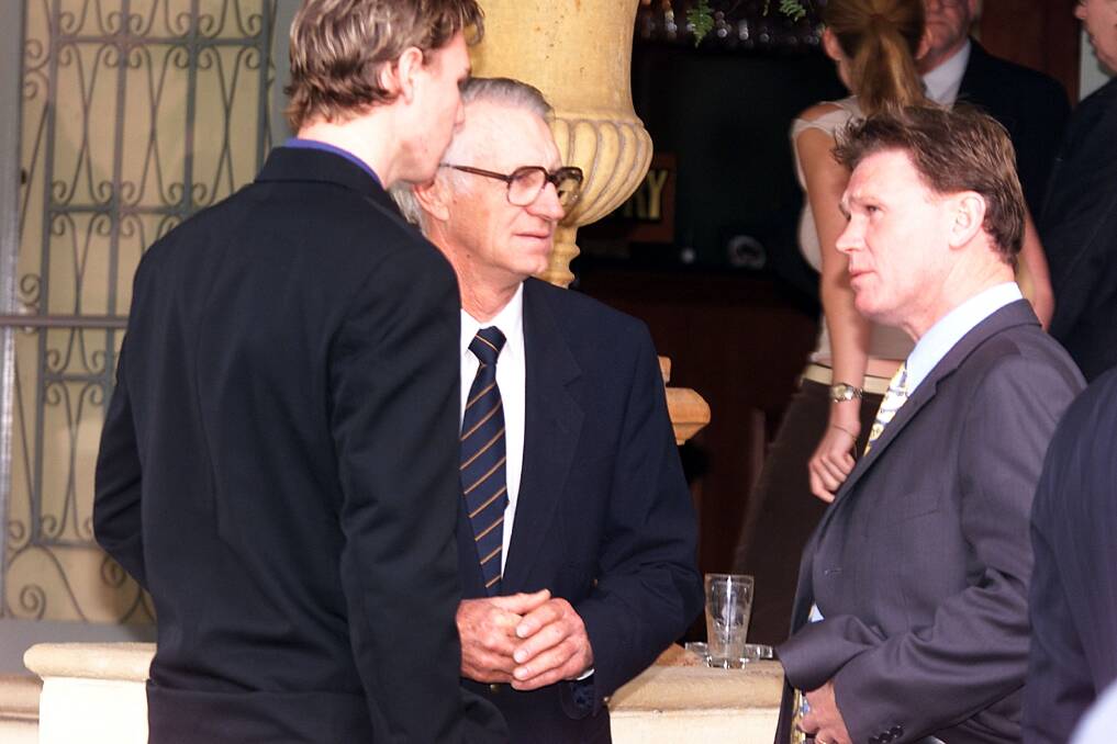 League president Merv Wegener with Justin Koschitzke and former St Kilda president Rod Butterss at Brocklesby's sports luncheon in Albury in 2002.