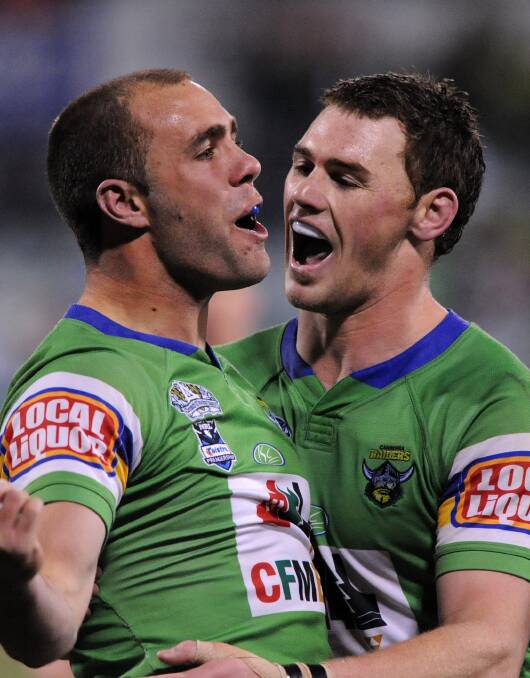 Former Raiders centre Adrian Purtell, left, is congratulated by teammate Joe Picker after his try against the Gold Coast Titans at Canberra Stadium in 2008.