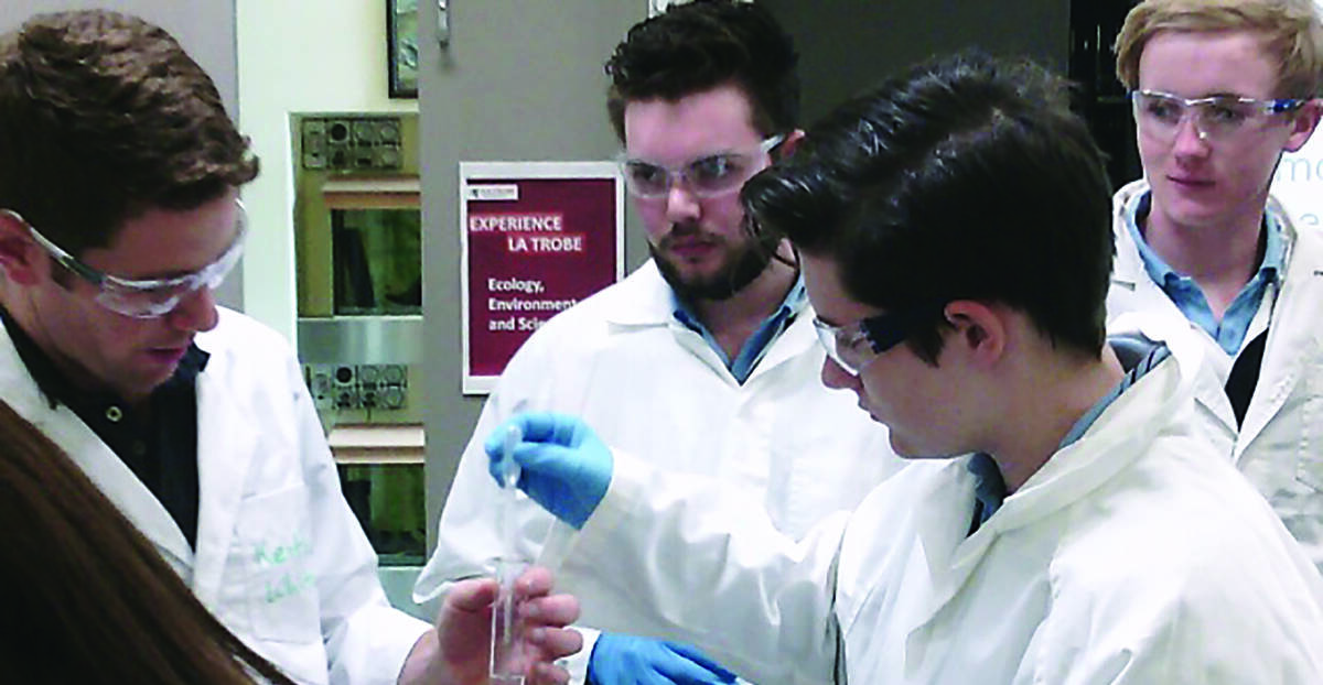 Dr White is pictured with Jesse Gardner–Russell, Chloe Mitchell and Ben Lyons as they recrystalize Asprin.