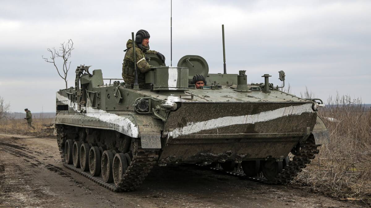 An armoured vehicle rolls outside Mykolaivka, Donetsk region, the territory controlled by pro-Russian militants, in eastern Ukraine, Sunday, Feb. 27, 2022. Photo: AP Photo