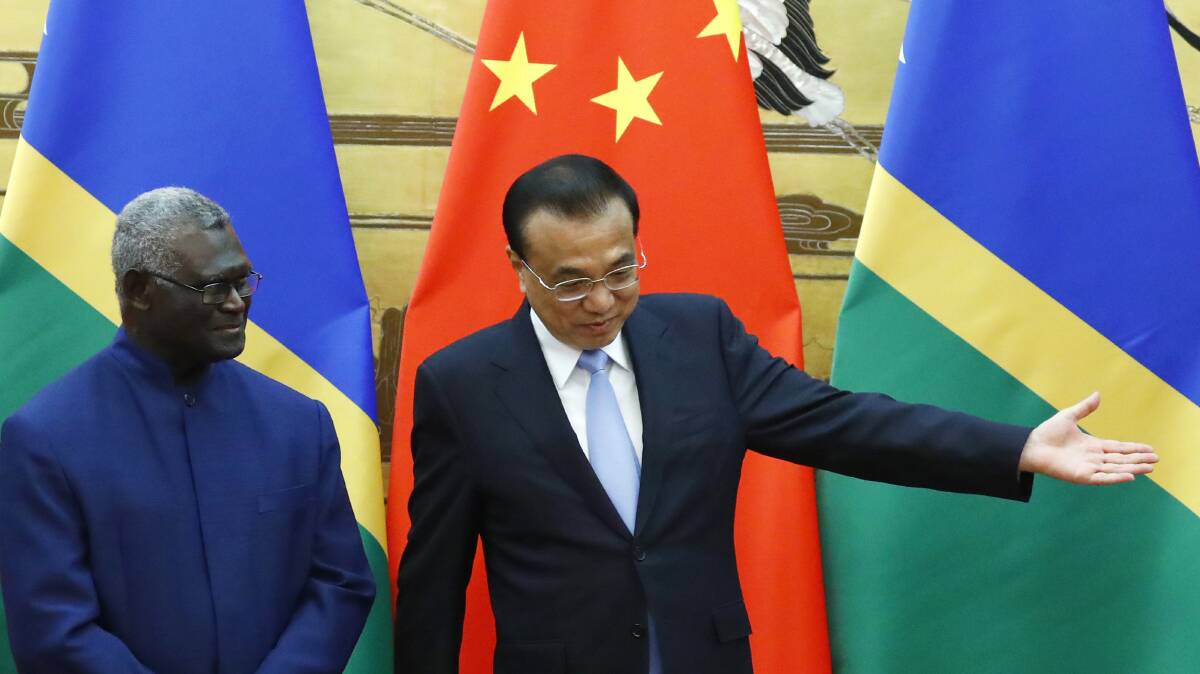 Solomon Islands Prime Minister Manasseh Sogavare, left, and Chinese Premier Li Keqiang in 2019. Picture: AAP