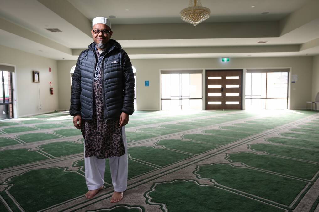 Roomy: ASM Asaduzzaman stands inside the prayer hall which features carpet with a pattern on the diagonal so it points towards Mecca. Picture: JAMES WILTSHIRE