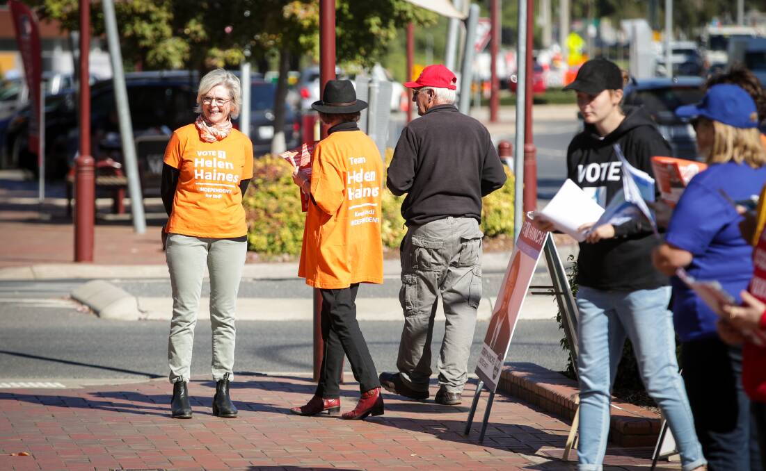 In limbo: Helen Haines, in her trademark orange during the election campaign, has been left with an uncertain timeframe before she is officially declared the new member for Indi.