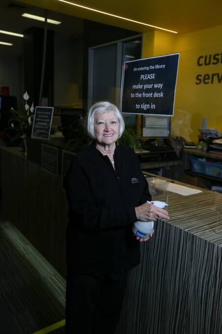 Trigger point: Judy Kennedy has had to adapt to coronavirus cleaning measures in the final months of a 50-year career in libraries which began when they were much more staid places. Picture: TARA TREWHELLA 