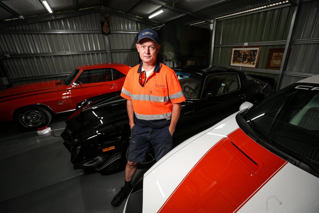 Petrolhead: Nico Mathews with some of his Camaros, including a red and white model that will be at Bathurst. Picture: JAMES WILTSHIRE