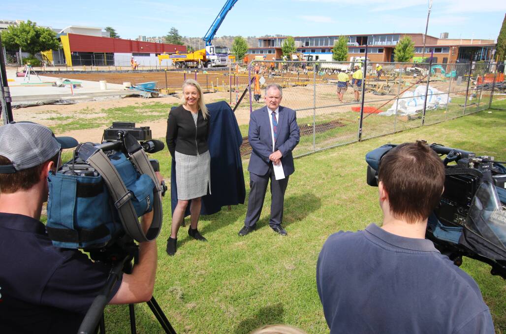 Concrete progress: Senator Bridget McKenzie and Wodonga Senior Secondary College principal Vern Hilditch in front of the construction site for the school's new stadium with Galvin Hall top right. Picture: MATTHEW CUMMINS