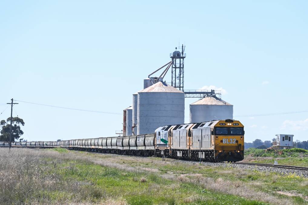 Heavy load: A grain train at Sanger on the Benalla-Oaklands line, which Federation mayor Pat Bourke would like linked to the Boree Creek railway. Picture: MARK JESSER