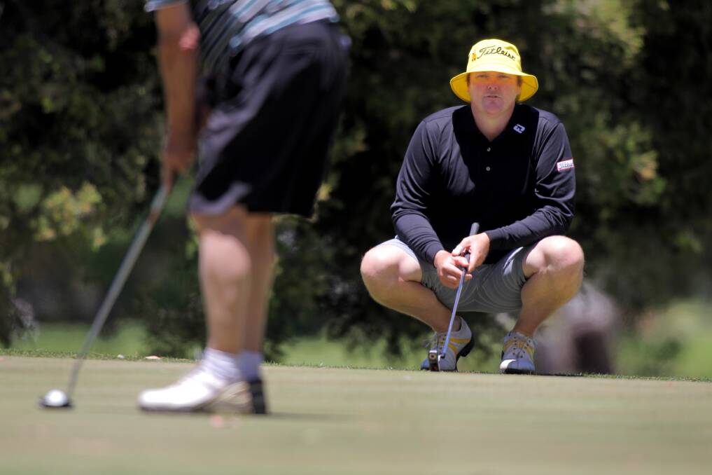 Eagle-eye: Jarrod Lyle watches on as a partner in his group at the Albury Commercial Golf Resort pro-am in 2014 prepares to putt. 