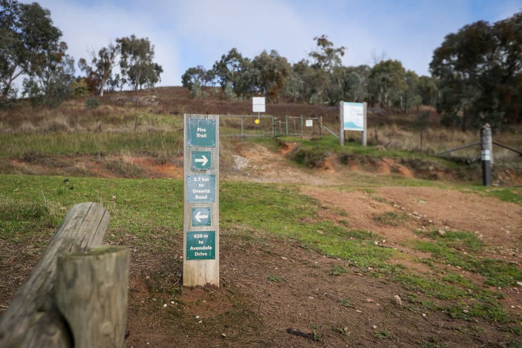 Weather worn signage marking a track at Federation Hill. Upgrading information boards is an imperative in a new table of priorities. Picture by James Wiltshire