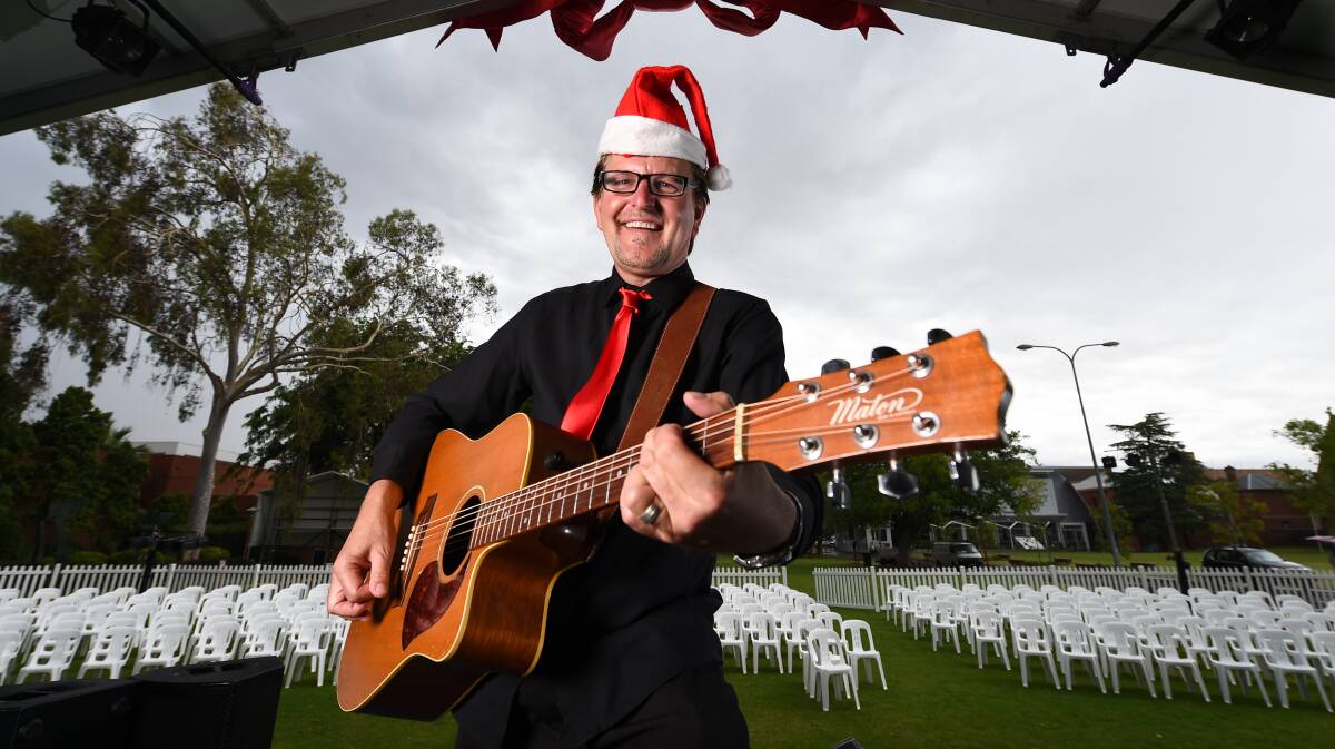 Flashback: Albury Carols by Candlelight musical director Paul Gibbs on stage in 2016. If the event proceeds this year distancing rules mean chairs should be further apart. 