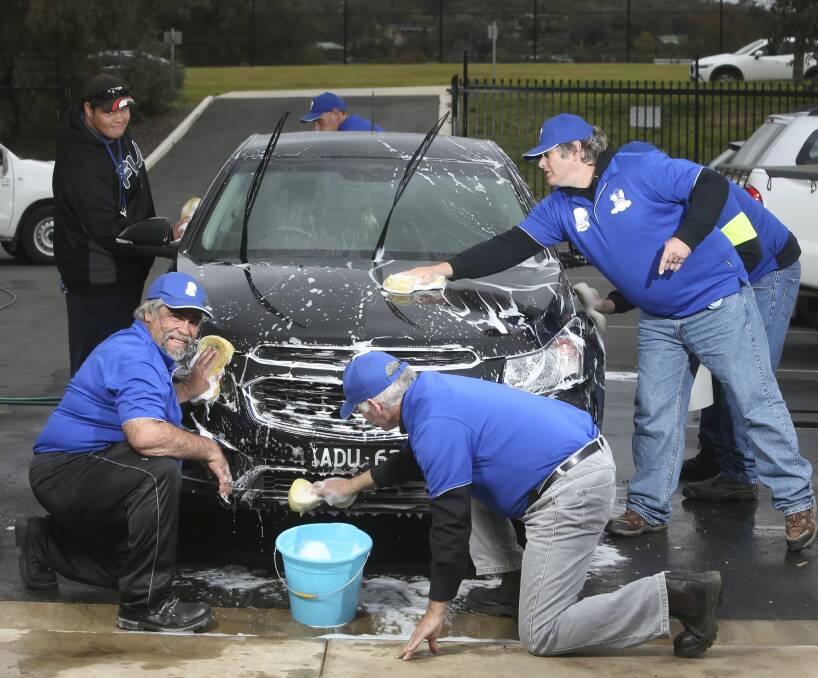 Shining example: Spongies Car Wash crew Shaune Cashion, Kyle Sullivan and Paul Cahoon (back) and Daniel Quinn, Peter MacMurray, and Robbie Forrester (front) show their skills. Picture: ELENOR TEDENBORG