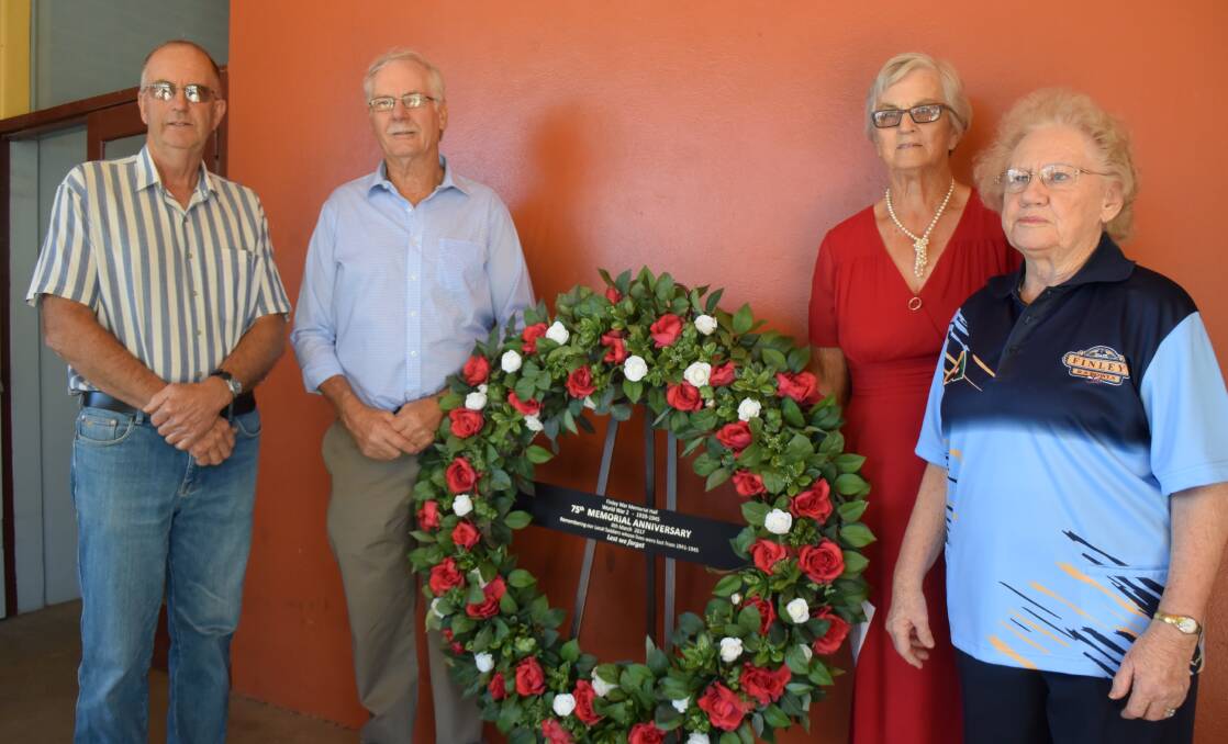 Remembering their uncles: Peter Horneman, Donald Strang, Kathleen Moorse and Lola Wilson with a wreath commemorating the 75th anniversary of the killing of Jack Horneman and Donald Strang on March 8, 1942.