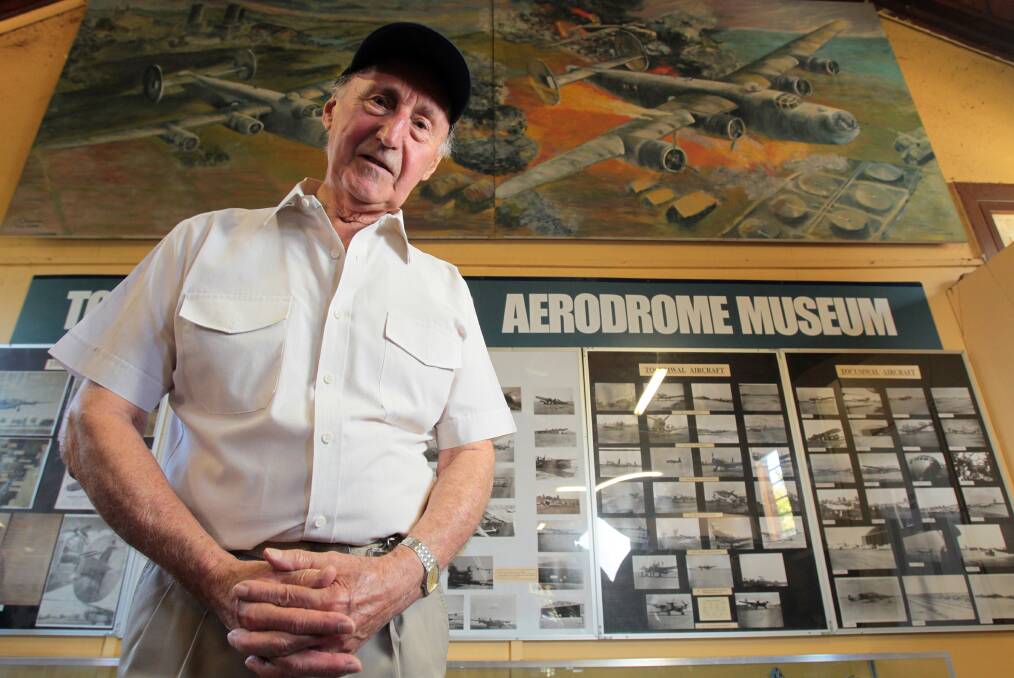 Pride of Tocumwal: Bob Brown, pictured in 2012, with his collection which includes 4000 photographs, books, newspaper clippings, paintings and model planes. 