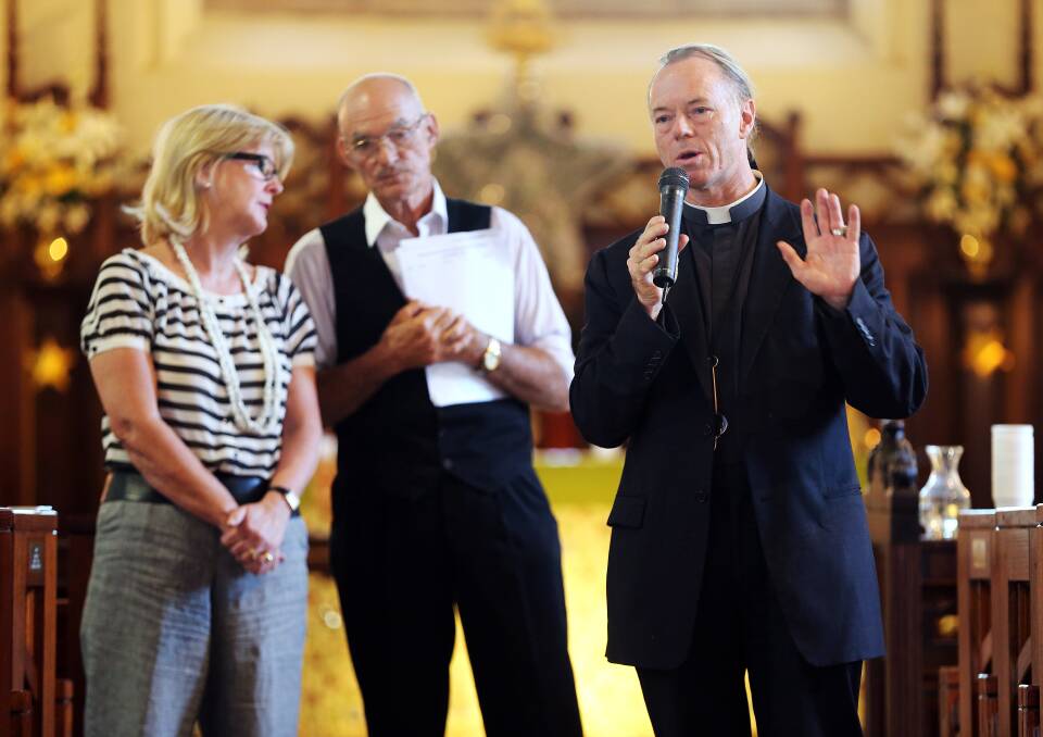 Not necessary: Anglican priest Father Peter MacLeod-Miller does not believe church exclusion zones are required. He is pictured with Susie Reid and Pieter Mourik during a meeting in 2014 calling for action over protests at Albury's abortion clinic. 