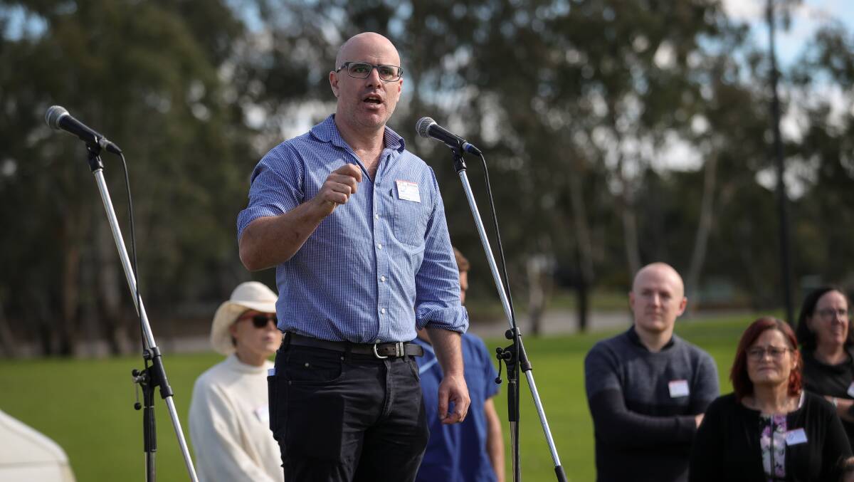 Come together: Border Medical Association representative David Clancy speaks at the rally last month on the Lincoln Causeway calling for a new Albury-Wodonga hospital.