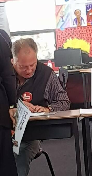 On the job: A photograph of Jeremy Kewley at the Rutherglen Primary School polling booth on Saturday. The image was posted on Facebook.  