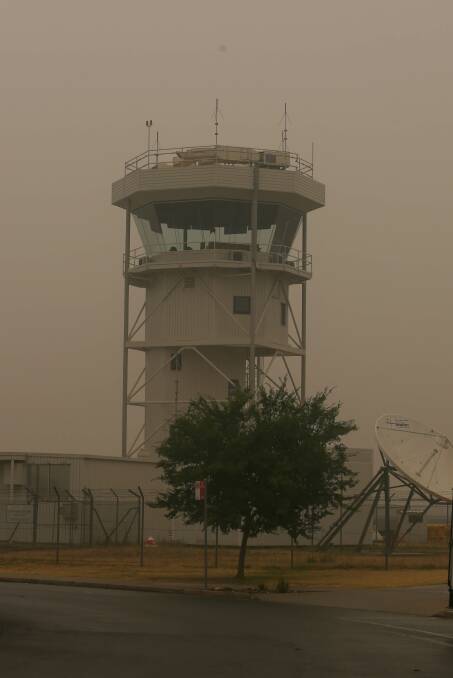 Hazy day: Smoke at the control tower at Albury airport last month. A NSW inquiry will examine the response to the air pollution from bushfires. Picture: TARA TREWHELLA