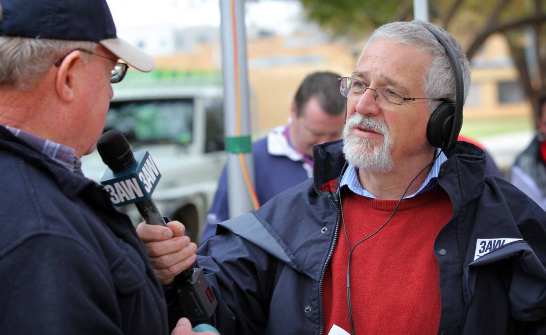 Neil Mitchell speaks to a listener during a visit to Albury in 2011 which saw him broadcast from QEII Square. 
